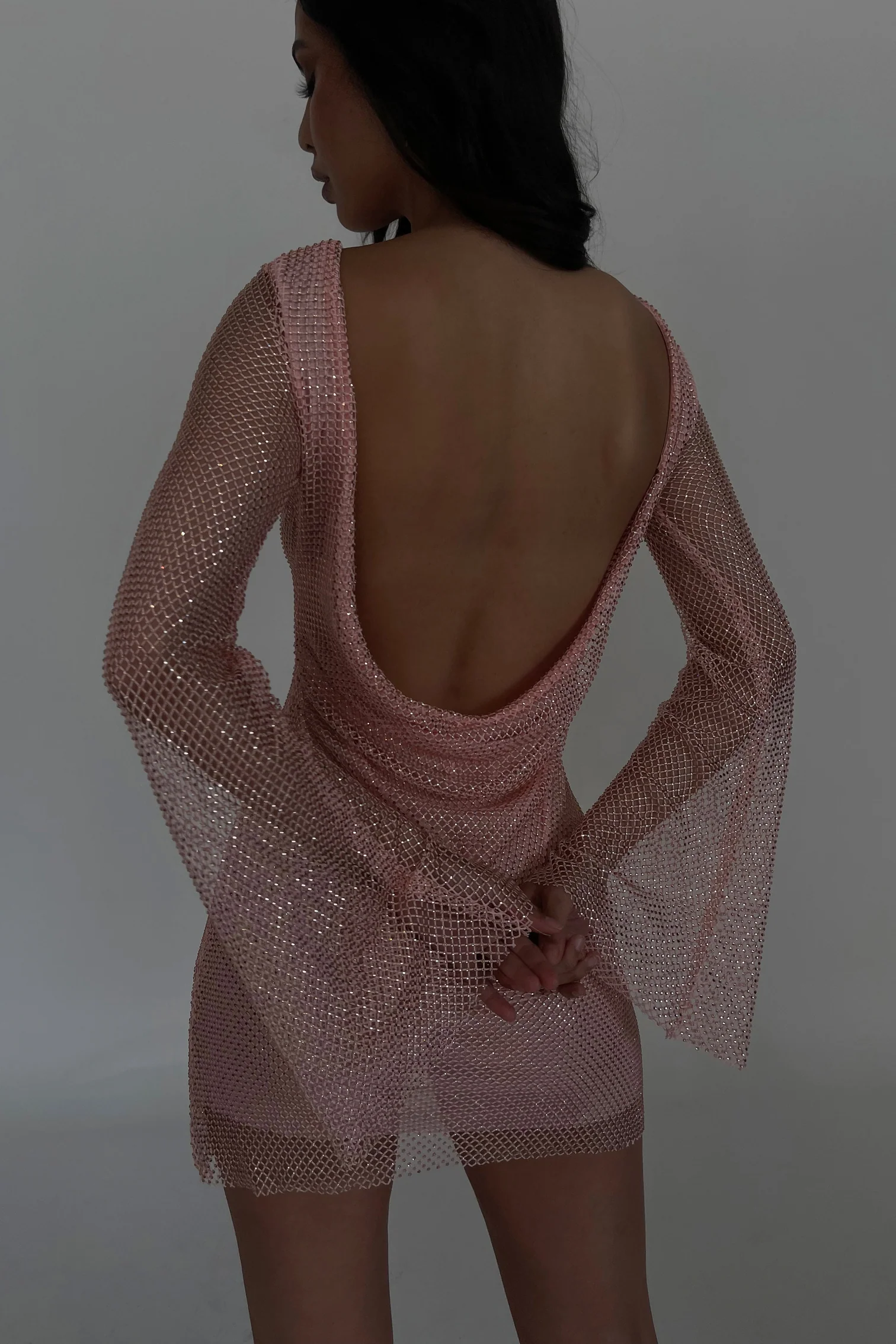 Meshki Samira Dress for rent. Pink sequin mini dress with open back.