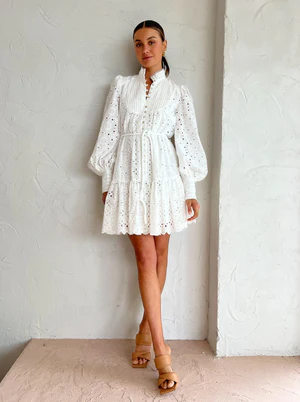 Alemais Evie Mini Smock Dress. White long sleeve ruffle mini dress for rent.