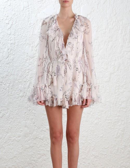 Zimmermann Paradiso Floating Floral Playsuit. Pale pink ruffle playsuit for rent.