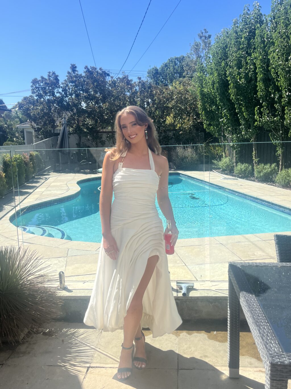 White halter neck maxi dress with side split for hire by Aje